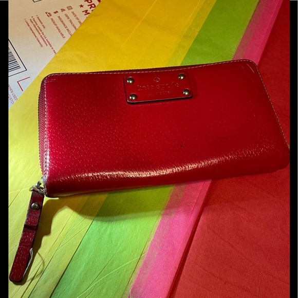 Kate Spade’s Vintage Red 100% Cow’s Leather Zip Around Wallet